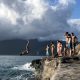 Diving off a cliff on a vacation