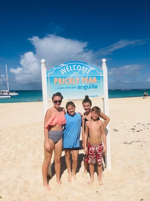 family on beach vacation from Michigan