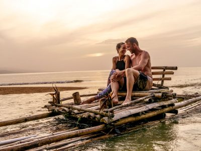 Couple on a raft exploring the ocean